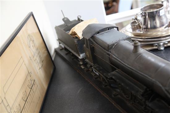 A scratchbuilt model of a 262 steam powered locomotive and tender,